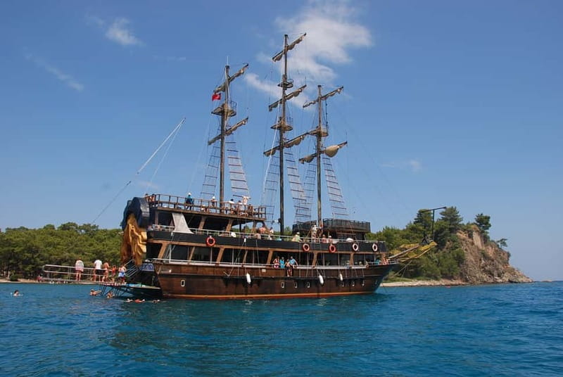 Alanya: Pirate Boat Trip with Meal, Drinks and Pickup Option - A pirate boat with a Turkish Riviera view
