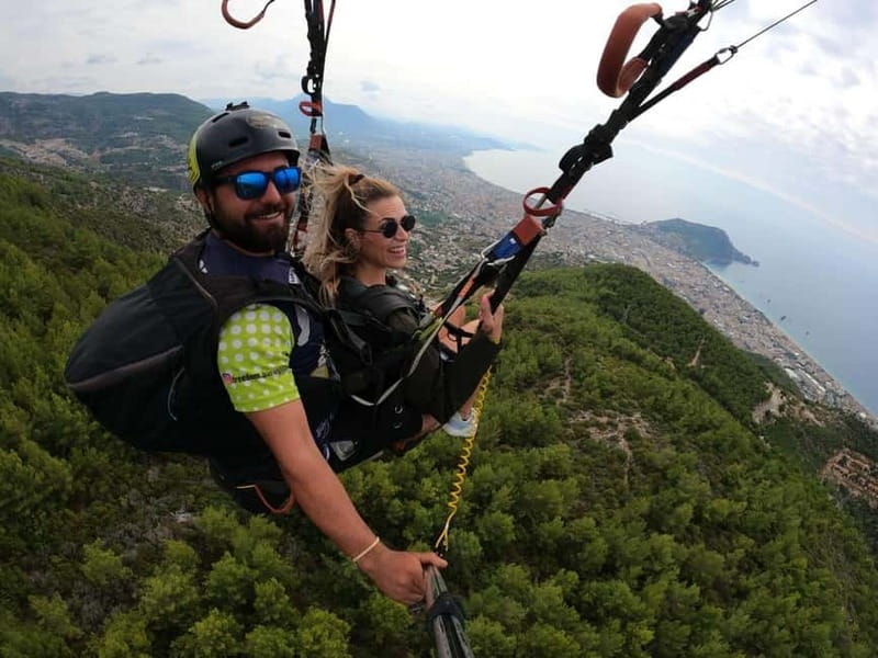 Alanya: Tandem Paragliding Experience with Video Option - Landing on the beach and the office presentation