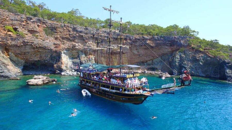 Antalya & Kemer: Pirate Boat Tour With Foam Party & Swimming - Phaselis: ruins beside a calm pebble beach