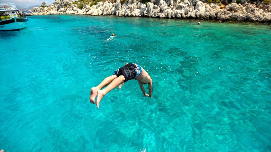 Bodrum: Orak Island Boat Tour with Swim Stops and Lunch - Red Nose Bay and its gray rock walls