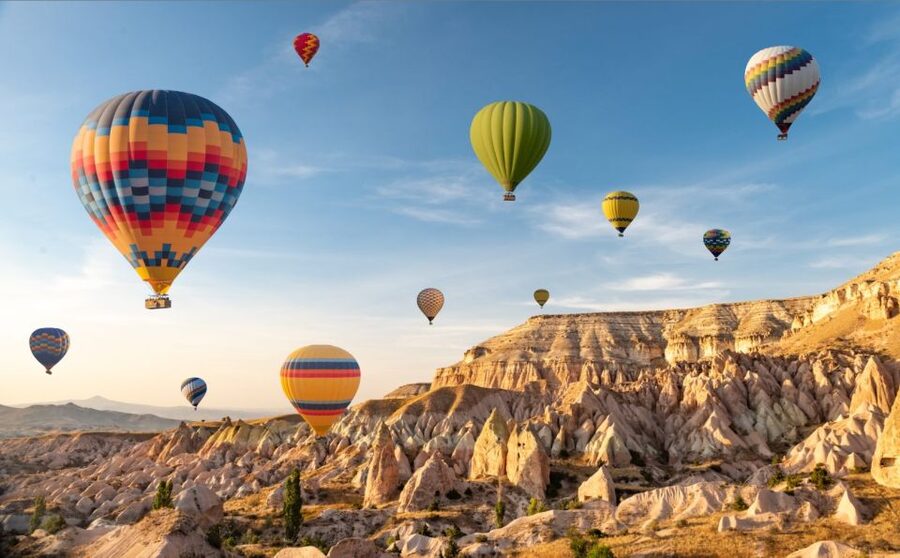 Cappadocia: Sunrise Balloon Watching Tour with Photographer - Love Valley adds fairy chimneys and warmer sunlight
