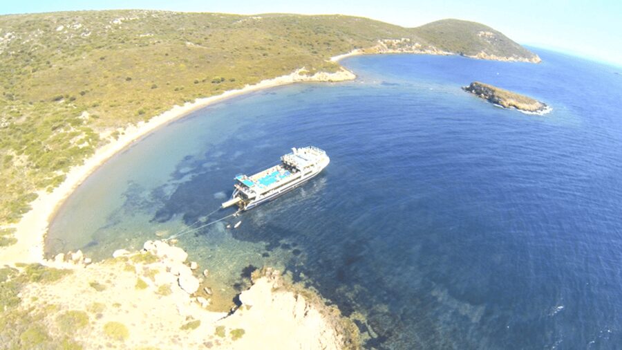 Cesme: Islands and Bays Boat Trip with BBQ Lunch - Sun loungers, facilities, and onboard atmosphere