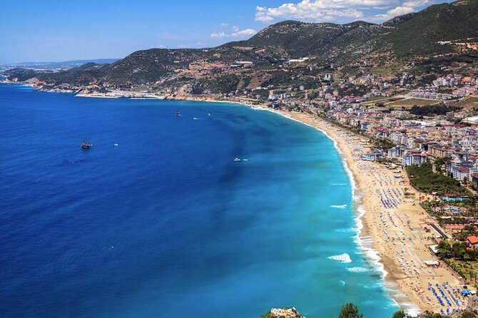 From Alanya: Sightseeing Half Day City Tour w/Cable Car - Hotel pickup and the open safari bus